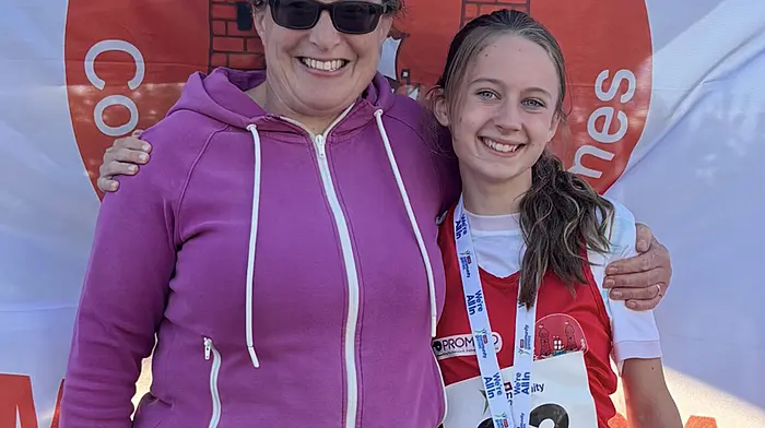 Ballineen's Erin O’Driscoll won gold in the U14 100 metres at the National Community Games in Carlow last Saturday.  Also included is Marie Collins (secretary, Enniskeane and Districts Community Games).