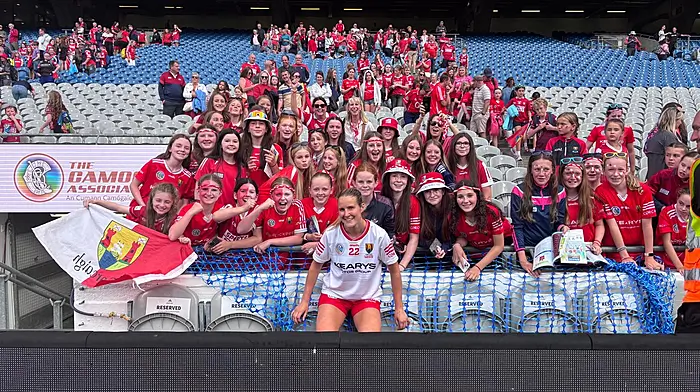 Ciara O'Sullivan with the large contingent from Newcestown camogie club who cheered on their clubmate as Cork won the senior All-Ireland camogie final.
