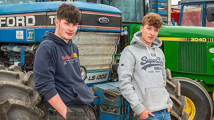 Kyle Wilmot and Harry Sebury from Bandon looking at the tractors on display at the Ahiohill Vintage Club’s annual harvest day.  (Photo: Andy Gibson)