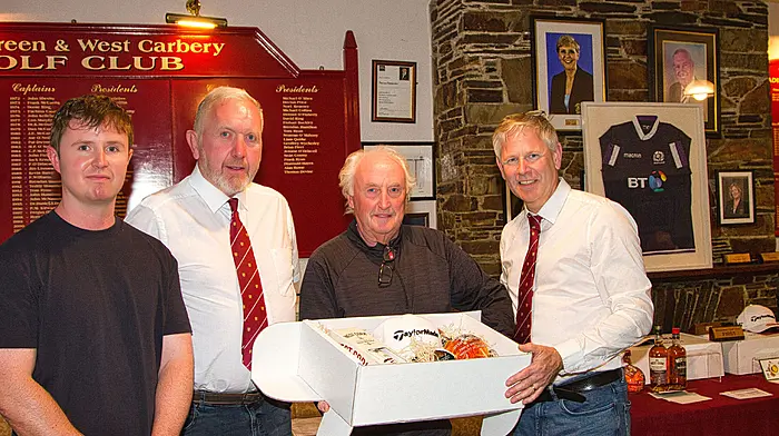 Liam Quirke (winner)  with his son David and Skibbereen RFC members Nealie Hourihane and Ollie Farrell.