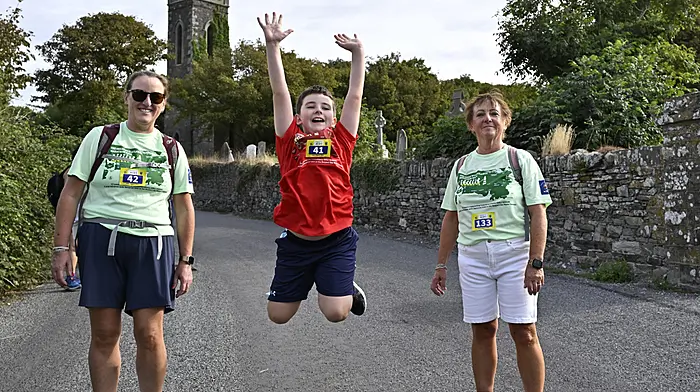 Local boy Johnny Fleming was in energetic mood at Lislee during the Courtmacsherry RNLI Great Wild Atlantic Marathon Walks last Sunday with his mum Michelle and grandmother Noreen. (Photo: Martin Walsh)