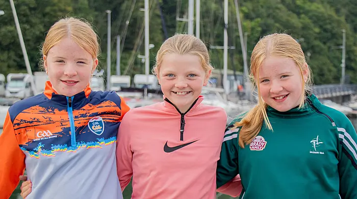 August 15thth, 2026, Bantry.The All-Ireland Coastal Rowing 2026 Championships taking place in Bantry this weekend attracted huge crowds, not all the spectators were concentrating on the rowing. Here Sadie Brennan, Celina Hurley and Katie Brennan enjoying the morning sunshine.Credit: Andrew Harris.
