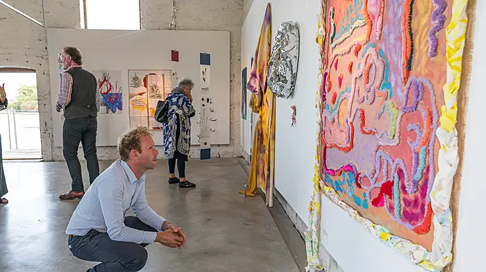 Niall O'Sullivan admiring the art at Sarah Walker Gallery.  (Photo: Anne Marie Cronin)