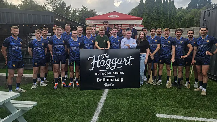 Victor Twohig, Sportsman Bar and Haggart outdoor dining area, Ballinhassig, making a presentation of playing gear to Ballinhassig GAA