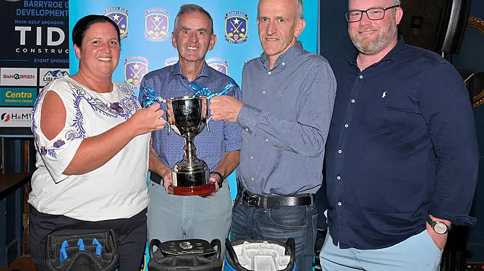 John Fleming presenting the Tide Construction Cup to Lorraine and Aidan Whelton, who along with their brother Darren, won the Barryroe GAA ground development golf classic at the Clonakilty Golf Club last Saturday.  Also included is Billy O'Donovan, a member of the organising committee.  (Photo: Martin Walsh)