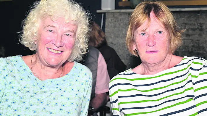 Locals Mags O'Callaghan (left) and Enda Gordon in the Courtmacshery Hotel for the Courtmacsherry Songs & Stories by the Sea event last weekend. Photo: Martin Walsh.