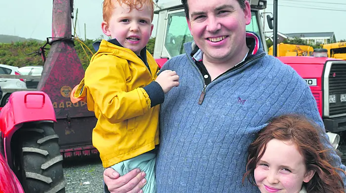 Jonathan, Penny and Hector O'Connell from Aghabullogue enjoying their day out at Tragumna Threshing Day last weekend. Photo; Anne MInihane.