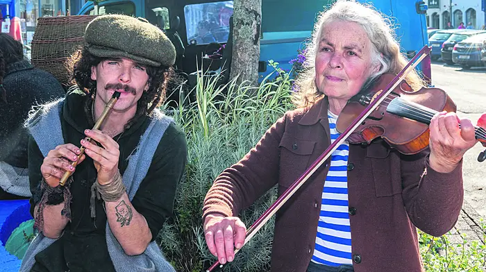 Alexander McGreevy from Glengarriff and Kristin Laubach from Tooin, Dunmanway entertaining shoppers at the Bantry market last Friday. (Photo: Andy Gibson)