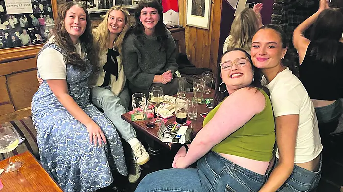 Aisling Connolly, Caoilainn O’Regan, Julie O’Sullivan, Ciara Little, and Ellen O’Mahony enjoying the Féile na Gaeilge table quiz at the Irish Whip.
