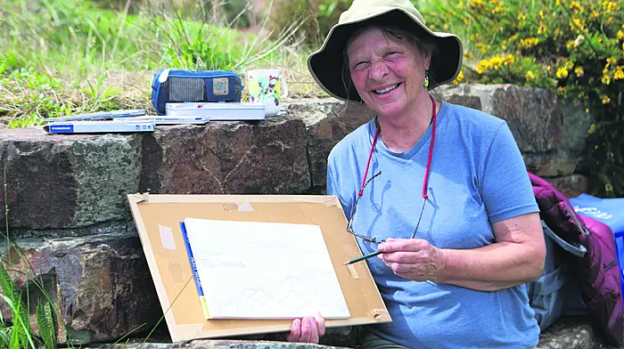 Artist Carol James takes inspiration from the beauty of Cadogan Strand in Schull as she sketches on location.    (Photo: Carlos Benlayo)