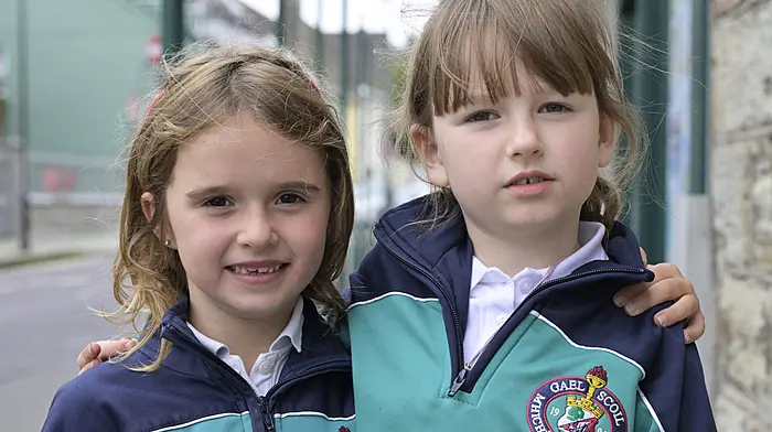Local first class pupils Ailbhe Sheehy (left) and Isla Murphy on their way home from Gaelscoil Mhichíl Uí Choileáin, Clonakilty.    (Photo: Martin Walsh)