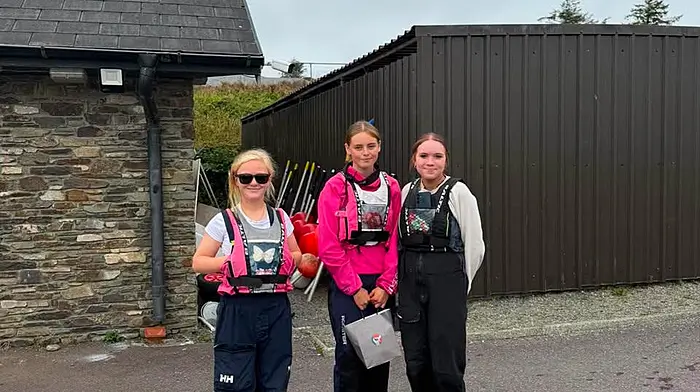 Lucy Copithorne presenting the prizes to the silver winners of the Ross Barnett Memorial Trophy, Millie McCarthy and Cara Lanin.