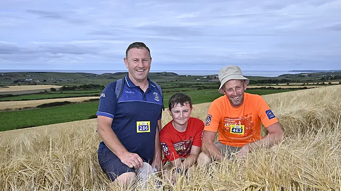 Locals Michael and Cian Coleman with Kieran Whelton during the recent Great Wild Atlantic Marathon Walks in aid of the Courtmacsherry RNLI. Aside from its great fundraising cause, the walks showcases the stunning scenic beauty of the Seven Heads Peninsula.    (Photo: Martin Walsh)