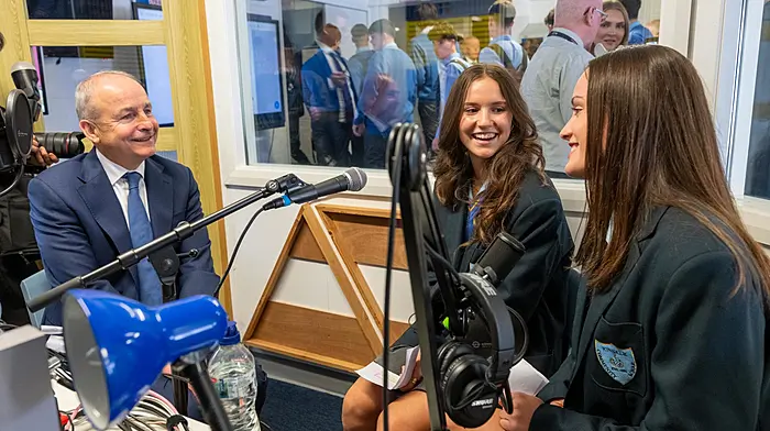 An Taoiseach Micheál Martin TD recording a politics podcast with students Elma Pallor and Jessica O’Keeffe during a visit to Kinsale Community School to turn the sod on the new extension.  (Photo: John Allen)