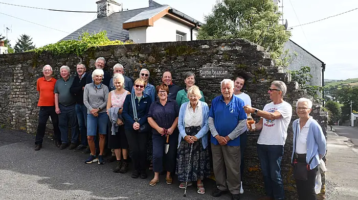 At the naming ceremony of Gairdín Bearachán the Castletownshend Community Garden were village elders Freda Salter-Townshend and Paul O'Driscoll, who unveiled the sign designed by artist Camilla Tyszkiewicz of House 2 Home, along with village gardeners last week.   (Photo: Anne Minihane)