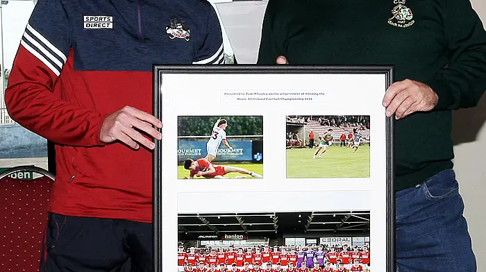 Chairman of Clonakilty GAA underage club David O'Brien makes a presentation to Cork minor footballer Tom Whooley.  (Photo: Paddy Feen)