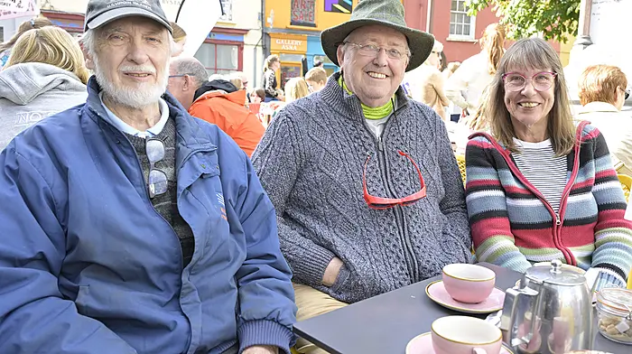 Enjoying the Clonakilty Guitar Festival in Astna Square were (left to right): Clonakilty's Colin Appleyard and Sean Ahern and Evita Sadlowski, Ballinascarthy.  Photo: Martin Walsh.
