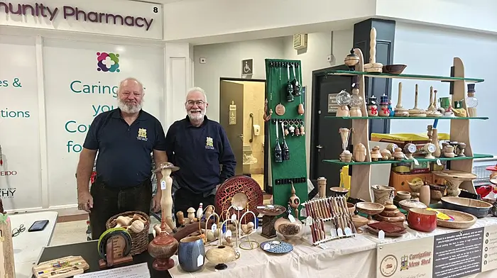 Colm Giltinan and Gerard Dubois on duty at the Carrigaline Men's Shed display in SuperValu Mall on Culture Night.