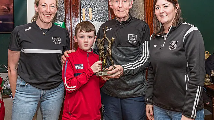 The Brian Murphy memorial trophy for the player of the day went to Éanna Wiseman. The trophy was presented by Jackie Murphy (Brian’s father), Laura O’Sullivan (vice-chairperson) and Amanda Cronin (secretary). From left: Laura O’Sullivan, Éanna Wiseman, Jackie Murphy and Amanda Cronin.   (Photo: Anne Marie Cronin)