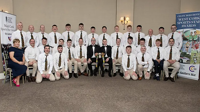 The All-Ireland winning Kilbrittain hurling team celebrate their 2025 West Cork Sports Star Team of the Year Award. Back from left, Dermot Hayes (chairman), Cian O’Leary, Damien Desmond (selector), Aaron Holland, Keith Hunt, Tomás Sheehan, Eoghan Byrne, Tomás Harrington, Sam Dewey, Adam Griffin, Gavin O’Shea, Terry O’Regan (goalkeeping coach), Bertie Butler and Oliver O’Brien (treasurer). Front from left, Marion Twohig (secretary), Mark Eaton (S&C coach), Charlie Kenny, Eoin O’Neill, Conor Hogan, David Desmond, Joe Ryan (manager), Philip Wall, Declan Harrington, Mark Hickey, Seán Sexton, Luke Griffin and James Hurley.  Kneeling, Padraic Maher (selector), Josh O’Donovan, Ronan Crowley and Aidan O’Connell (selector). (Photo: Martin Walsh.)