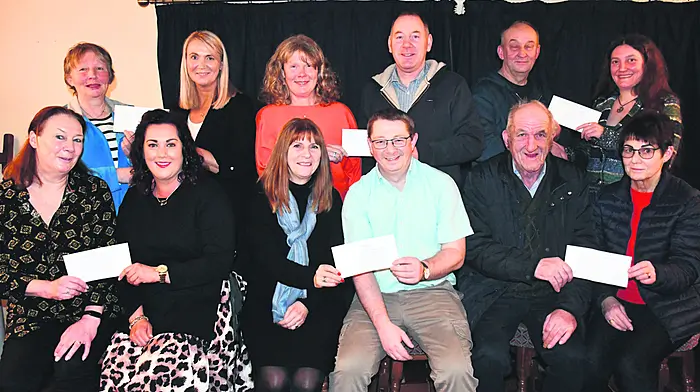 Members of Tragumna threshing committee presented the proceeds of their annual fundraising events to local charities at the weekend. Front: Nollaig Frost presenting a cheque to Martina O'Regan (Bantry Hospital Rehab Stroke Unit),  Yvonne Davidson (Aid Cancer Treatment) receiving a cheque from Liam O'Driscoll, and Ger Murphy presenting a cheque to Mary Willis (Skibbereen Day Care Centre).  Back: Deirdre O'Donovan making a presentation to Caroline Salter (Co-Action Skibbereen), Frances O'Donovan (Cope Horizons) receiving a cheque from Fergus Courtney and Noel Camier  (Cork South West Autism Support) receiving a cheque from Deorah Lenihan.   (Photo: Anne Minihane)