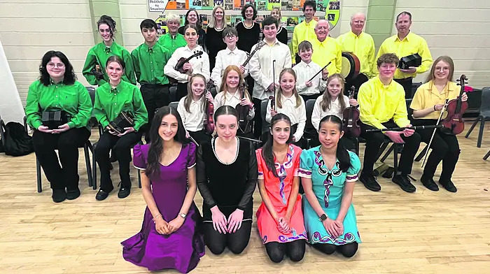 The Comhaltas na Dúglasie Scoraíocht team who were placed third in the All-Ireland scoraíocht competitions last Sunday at Brú Ború in Cashel, Co Tipperary. Front: Aoife Ní Nuanáin, Sinéad Ní Rinn, Órla Ní Nuanáin and LeAnn Lam. Second row: Saoirse O'Brien, Síle Fitzgibbon, Lily Harrington, Eimear Fitzgibbon, Caragh Cronin, Tara Harrington, Fionn McCarthy and Daisy Hackett. Third row: Roisín Ní Nuanáin, Charlie McKibben, Lena Kennedy, Pádraig Fitzgibbon, Tomás Walsh, Alex Kennedy and Barry Cogan.
Back row: Ian Pitt, Nora Uí Nuanáin, Bríd Fitzgibbon, Katja Quast, Claire Crowley, Fionán Cogan, Tim O'Sullivan and Jerry Reen.