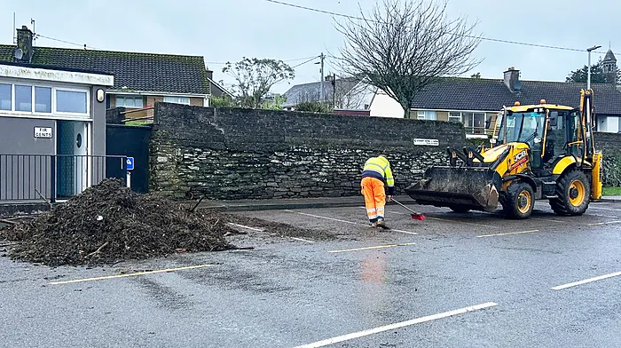 Cork County Council staff cleared the debris off the road beneath Timoleague Abbey following the high spring tides and strong winds last Monday evening. (Photo: Martin Walsh)