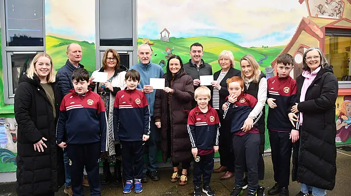 Skibbereen Rowing Club presenting the proceeds from their annual Christmas Day swim for the special classes at St Joseph's Girls National School, St Patrick's Boys’ National School and Gaelscoil Dr Uí Shuilleabháin.  From left: Niamh Casey (PRO, Skibbereen Rowing Club), Sean Murran (chairman, Skibbereen Rowing Club), Audrey Collins (Rang Naomh Eoin, St Joseph's NS), Tony Walsh (committee, Skibbereen Rowing Club), Aisling Ní Néill (Gaelscoil Dr Uí Shuilleabháin), Alan Foley (St Patrick's Boys’ NS), Nuala Lupton (president, Skibbereen Rowing Club), Emer Courtney and Siobhan Harte (St Patrick's Boys’ NS) and pupils Jack O'Brien, Dylan Hayes, Anthony Hodnett, Miah Duggan and Tony McCarthy.   (Photo: Anne Minihane)