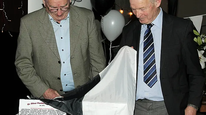 Chris Walsh and Con McCarthy unveiling special plaques at Plunkett's 50th anniversary. (Photo: Paddy Feen)