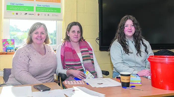 Siobhan Horgan, Johnstown, Hazel Sweetnam-O'Mahony, Dunmanway, and Kate Horgan, Johnstown, registering participants and selling tickets at the St. Enda’s National School, Kilnadur tractor and car run. (Photo: David Patterson)
