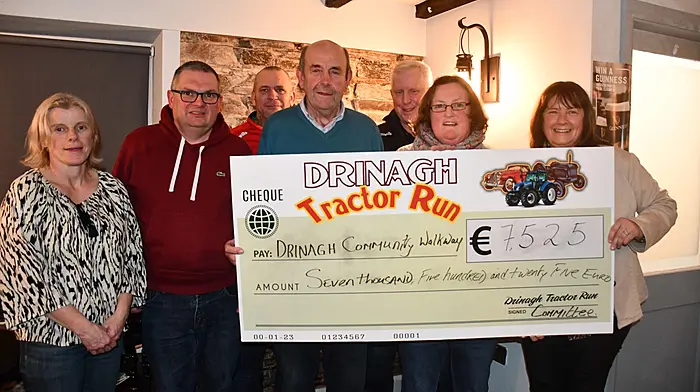 The annual Drinagh Tractor Run committee members Sarah Collins, Robert Ellis, Margaret Murphy and Colette Collins presenting a cheque for Ä7,525 to Drinagh Community Walkway to Don Hurley, David Curran and Declan at the Gaelic Bar in Drinagh. Photo; Anne Minihane.