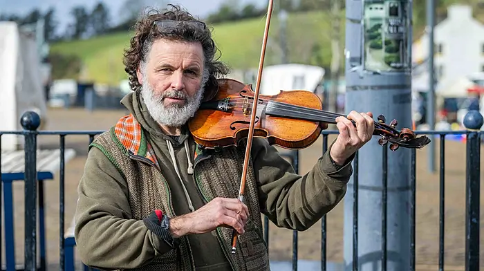 John Baker from the Mealagh Valley entertaining people who were out and about at the market in Bantry on Friday. (Photo: Andy Gibson)