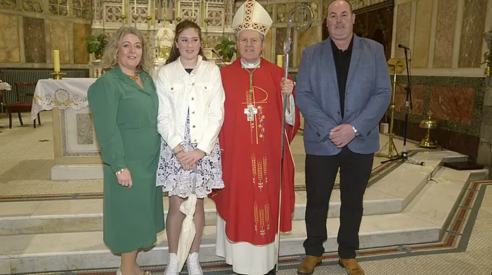 Isabel Murphy, Macroom Road, with her parents Olive and Brian alongside Bishop Fintan Gavin at Isabel’s Confirmation which was celebrated at St Patrick’s Church in Bandon.   (Photo: Denis Boyle)