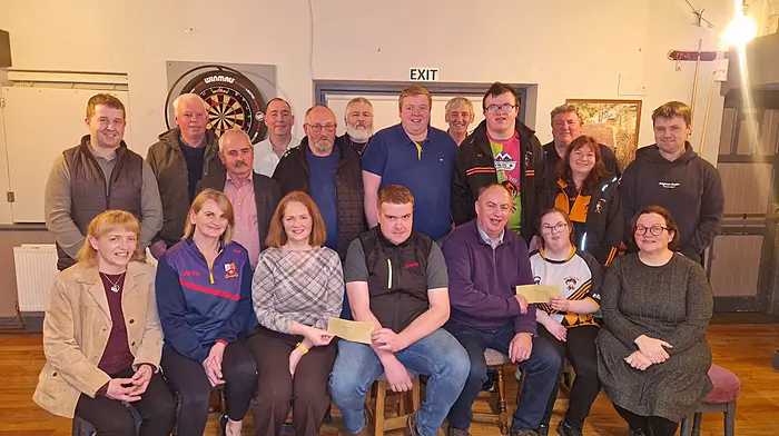 The Caheragh Vintage and District Club presented funds of €3,000 to the Tadgh MacCarthaigh ladies GAA and €3,000 to the West Cork Jesters, which were the proceeds from a tractor run they held on St Stephen’s Day. Back: George Gill, John Collins, PJ Murphy, Finbarr McCarthy, Timmy O’Sullivan, Brian Cotter, Pat McCarthy, Stiofán Cronin, Mike Cronin, Mairead Cronin and Niall Collins.  Front: Helen Collins, Mags Harrington, Deirdre Barry, Humphrey O’Sullivan, Micheál Kirby, Emily Cotter and Fiona O’Sullivan.  Missing from the photo is club member Tony O’Driscoll who was part of the fundraising campaign but unfortunately passed away on January 10th.