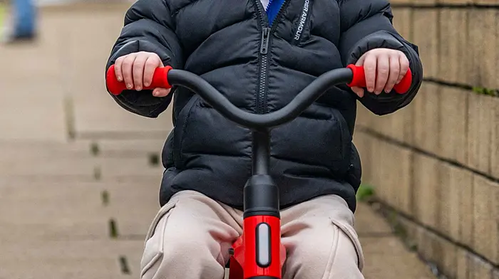 Bantry, West Cork, Ireland. 13th Feb, 2025. Bantry Friday Market took place today with tourists and locals out & about in force. Having fun on his trike was 2-year-old Isaac O'Sullivan from Bantry. Picture: Andy Gibson.