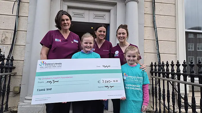 Molly Tyner with her sister Nora (right), along with the paediatric neurosurgery CNS team, Cora Vizzard, Ciara O’Prey and Annette Reddy.