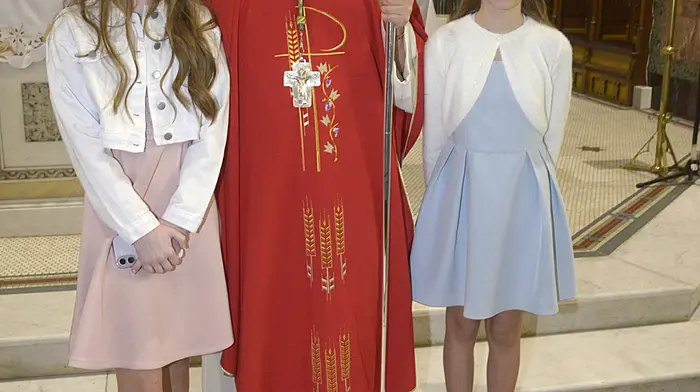 NEWS10/2/2026 Pictured celebrating their confirmation with Bishop Fintan Gavin atSt Patricks church Bandon were Bandon primary school students Olivia O'Regan and Andrija Patasioraite. Picture Denis Boyle