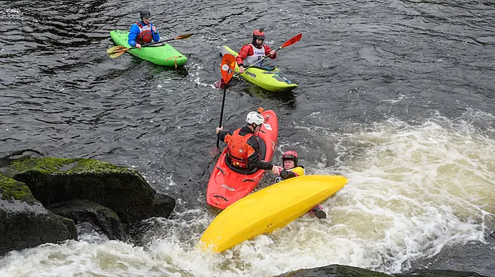 Sean ‘Gadget’ Lynn (Cobh) helping rescue Orlagh O'Regan (Kinsale) after a capsize at the double drop feature while taking part in the first event of the day, an individual time trial  at day one of Cork Fest, a whitewater kayaking event which took place on the Upper Bandon river, north of Dunmanway.   (Photo: David Patterson)