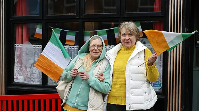Jolanta Polaszek, from Poland, and Victoria Parfionova, from Lithuania, enjoy the  St. Patrick's Day parade in Ballydehob. Photo by Carlos Benlayo