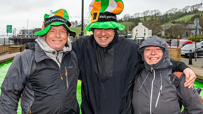 Bantry, West Cork, Ireland. 17th Mar, 2026. A huge number of people turned out for the Bantry St. Patrick's Day parade, despite the wet weather. Grand Marshall for the event was Graham Canty, the Cork GAA Footballing legend. Pictured at the Bantry St. Patrick's Day parade are John MacCarthy; David Sullivan and Bernie O'Regan, all Bantry. Picture: Andy Gibson.
