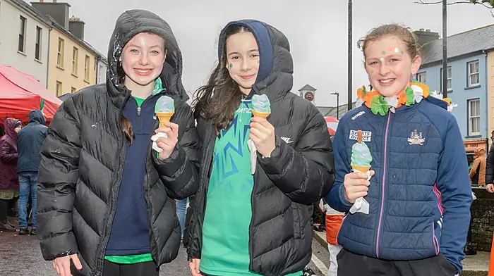 Natalie Crowley and Fia O'Sullivan (both Dunmanway) and Aoibhinn O'Donovan (Drimoleague) enjoying their green ice-creams at the Dunmanway St. Patrick’s Day parade. Picture: David Patterson, Tractor Run - Cork