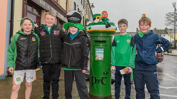 Eolann Hayes and James McSweeney(both Ballinacarriga), Darragh O'Brien (Dunmanway), Senan Coakley and Robert O'Regan (Ballinacarriga) at the Dunmanway St. Patrick’s Day parade surrounding the post box with a St. Patrick's Day nitted decoration created by the the talented ladies of the Knitter Knatter group. Picture: David Patterson, Tractor Run - Cork