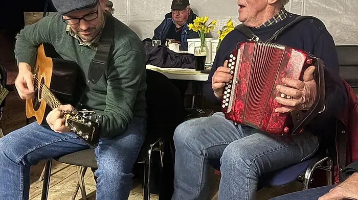 Kieran Daly and Finbarr Brickley keeping the tradition of the sing-song going after Rath Vintage Club’s threshing day.