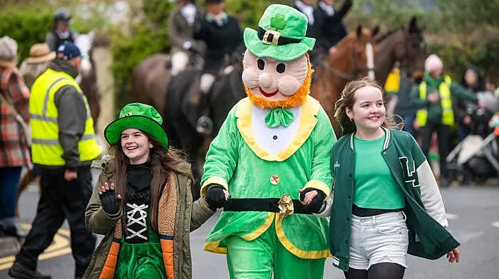 Lucy and Jessie Hunt from Belgooly marching with Larry the Leprechaun at the annual Kinsale St Patrick Day parade.   (Photo: John Allen)
