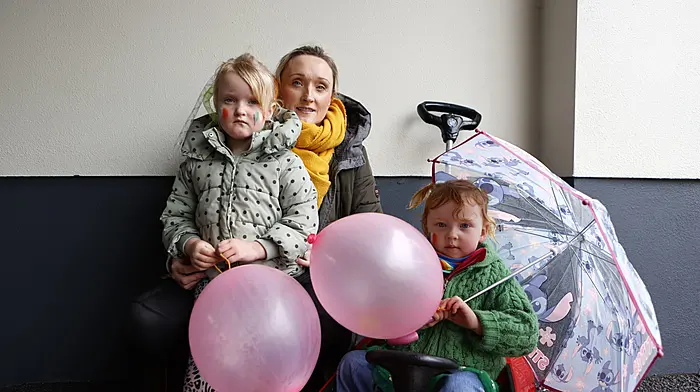 Theresa O'Sullivan with  her daughters , Maya and Grace, as they get ready to take part in the St. Patrick's Day parade in Ballydehob. (Photo: Carlos Benlayo)