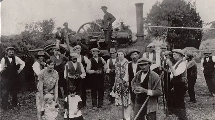 Threshing at Ballinreeshig, Co. Cork 1930s – Patrick Browne’s steam engine – he is standing on engine at rear. Photo courtesy of Fergal Browne