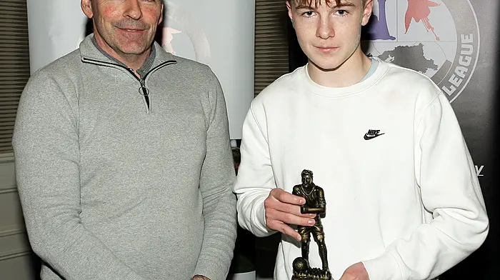 Tadhg Curtin, WCSSL Treasurer, presents the 2025 Boys U13 Player of the Year award to Danny Carroll, Dunmanway Town. (Photo: Paddy Feen)