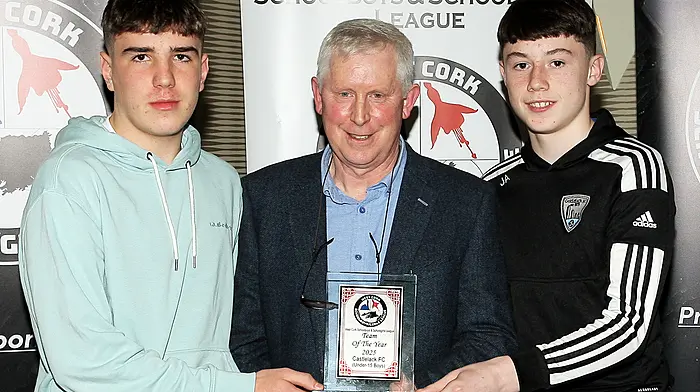 Declan Deasy, WCSSL Chairman, presents the 2025 Team of the Year award to joint winners, Castlelack U15 boys, represented by Alex Bemelmans and Jack Allen. (Photo: Paddy Feen)