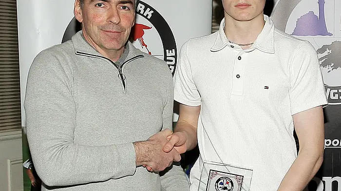 WCSSL Treasurer Tadhg Curtin presents the 2025 Fair Play Award to the Lyre Rovers U15 team, represented by Evan McAuley. (Photo: Paddy Feen)