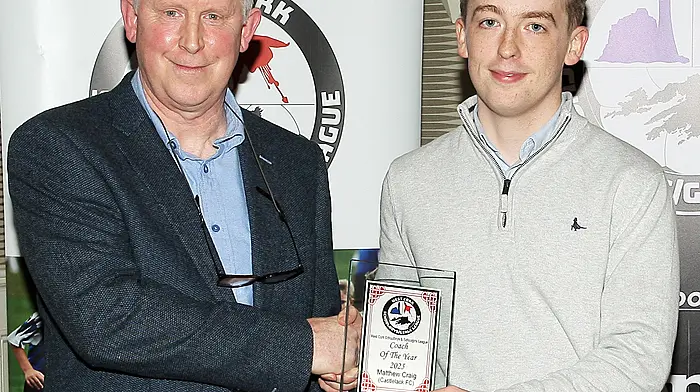 Declan Deasy, WCSSL Chairman, present the 2025 Coach of the Year award to joint winner Mathew Craig, Castlelack FC. (Photo: Paddy Feen)